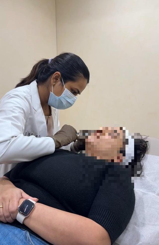 Dr. Praneeta Jain performing an injection-based acne treatment