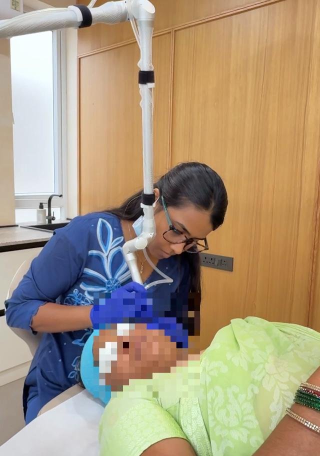 Dr. Praneeta Jain performing a targeted laser treatment